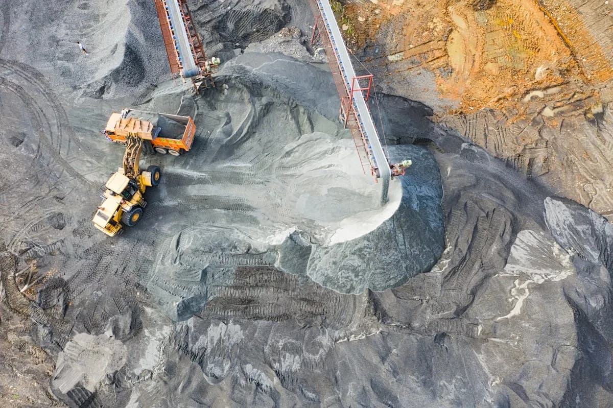 Aerial view of loader working at a mining and earthmoving operation